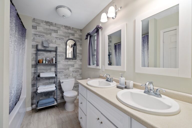 A modern designed restroom with white-painted walls and lavatories